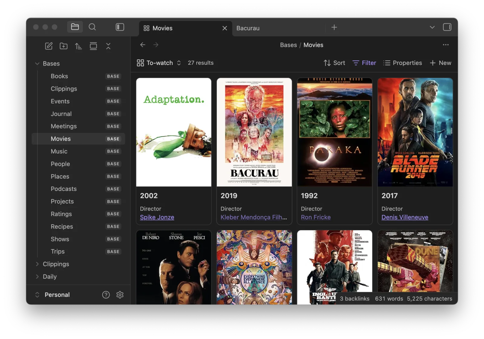 A Movies base shown as poster cards, in dark mode